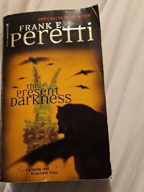 Frank E. Peretti "This Present Darkness" - Yellow & Black Paperback